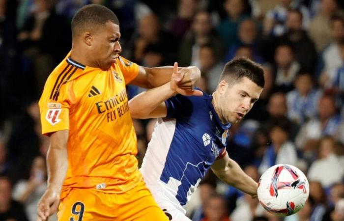 Real
      Madrid
      escapes
      Real
      Sociedad
      trap